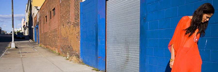 Woman in a red dress on a city street